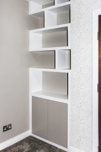 Contemporary style alcove bookshelves with cupboard, built in and hand painted in estate eggshell