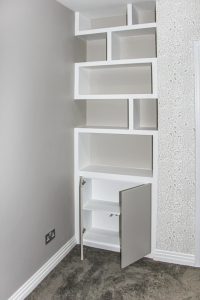 Contemporary style alcove bookshelves with cupboard, built in and hand painted in estate eggshell