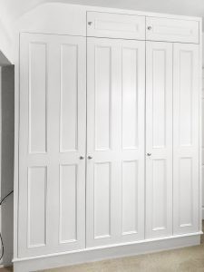 Bi-fold doors traditional style fitted wardrobe