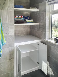 Bathroom bookcase with floating shelves. Made from humidity-resistant MDF