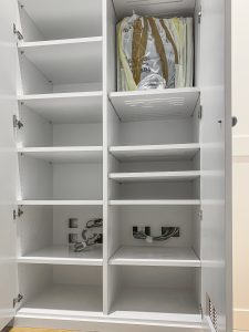 A huge wardrobe with media system and ventilation system installed