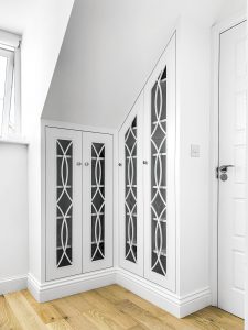 Loft Wardrobe with glass doors, fretwork and LED lighting inside