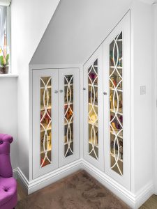 Loft Wardrobe with glass doors, fretwork and LED lighting inside