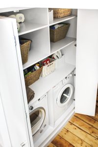 Laundry wardrobe with bi-folding doors. Includes space for laundry, washing machine, dryer, boiler and ect.