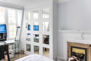 Loft Attic Wardrobe.Contemporary style sloping wardrobe fitted in the loft spare room. Another sample of fitted furniture created by our company is plain contemporary door wardrobe with cupboards and drawers along sloping ceiling. Good solution to fill dead space in your attic room.