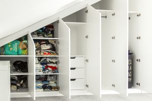 Contemporary MDF sloping wardrobe fitted in the loft spare room