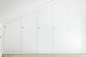 Contemporary MDF sloping wardrobe fitted in the loft spare room