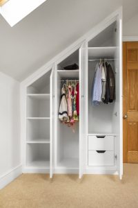 Contemporary MDF sloping wardrobe fitted in the loft spare room.
