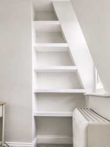 Sloping alcove floating shelves