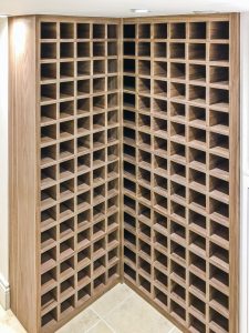 Wine racks for 210 bottles. Made from walnut veneer MDF and 3 times applied with bee wax.