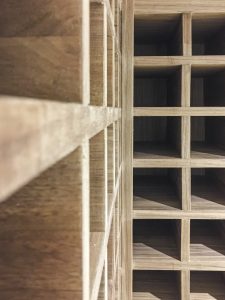 Wine racks for 210 bottles. Made from walnut veneer MDF and 3 times applied with bee wax.