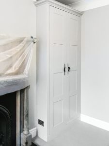 Alcove fitted wardrobes with Walnut veneer MDF inside and painted doors