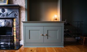 Two traditional style bookcases beside the chimney breast