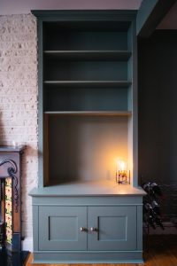 Two traditional style bookcases beside the chimney breast