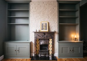 Two traditional style bookcases beside the chimney breast